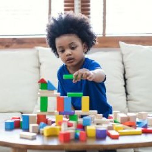 child playing with building blocks